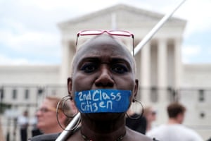 Abortion rights demonstrator Nadine Seiler tapes her mouth outside the supreme court in Washington.