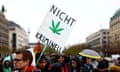 A person holds a sign in favour of legalising cannabis in Germany in 2022.