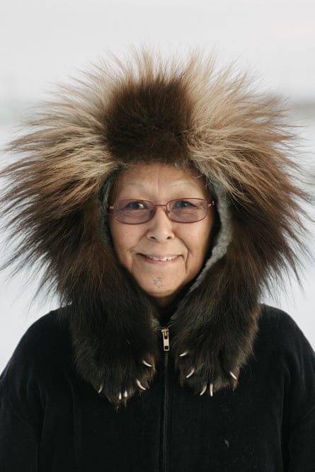 Fannie Akpik, Iñupiaq educator and survivor of Indian boarding schools, wears her traditional wolverine ruff parka, in Utqiagviq, Alaska.