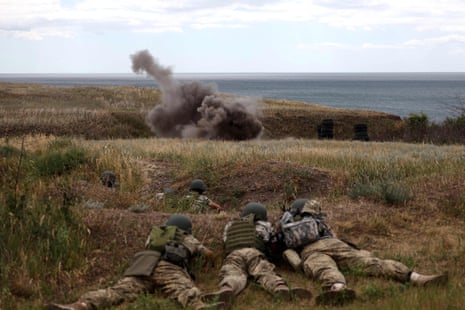 Ukrainian servicemen seen on training exercises in the Odesa area on 22 June. [This is a corrected caption. An earlier version wrongly stated that live combat was shown]