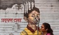 Mural Painting In Mumbai, India - 08 Nov 2023<br>Mandatory Credit: Photo by Indranil Aditya/NurPhoto/Shutterstock (14198304b) A woman walks past a mural painting of pollution on a wall in Mumbai, India, 08 November, 2023. Mumbai pollution worsens as many areas report 'poor' air quality with AQI above 250 according to an Indian media report. Mural Painting In Mumbai, India - 08 Nov 2023