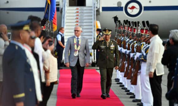 Malcolm Turnbull arrives ahead of the Asean summit in Manila on Sunday. Despite the political crisis at home, Turnbull says he will complete his overseas trip.