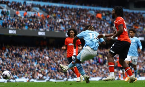 Manchester City's Jeremy Doku scores their fourth goal.