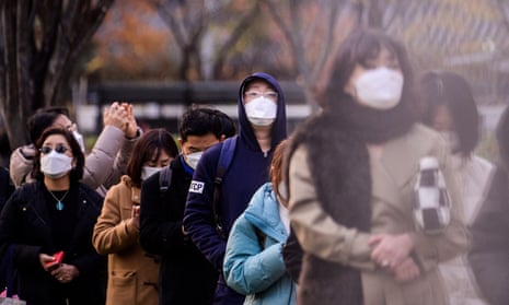 People queue for PCR (polymerase chain reaction) tests at a Covid-19 testing centre in Seoul on 24 November as daily recorded deaths hit record highs.