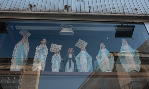 Virgin-and-child figurines in a shop window in Valletta, Malta.
