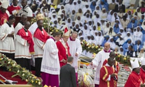 Pope Francis in a procession with other clergy after leading a holy mass in the Namugongo area of Kampala.