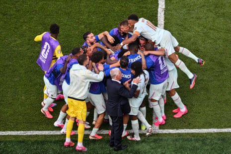 France's players celebrate after France's forward #07 Ousmane Dembele (hidden) scored his team's second goal