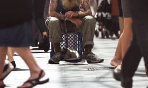 A man begs for money in Sydney’s central business district
