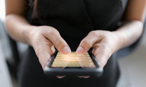 Close up of woman holding mobile phone