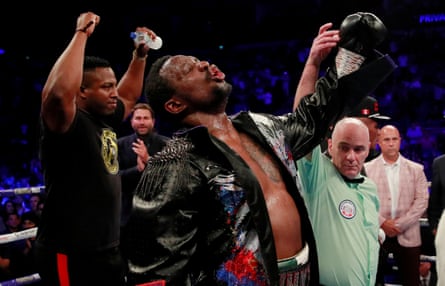 Eddie Hearn applauds as Dillian Whyte celebrates winning his WBC interim world heavyweight title fight against Óscar Rivas in July 2019