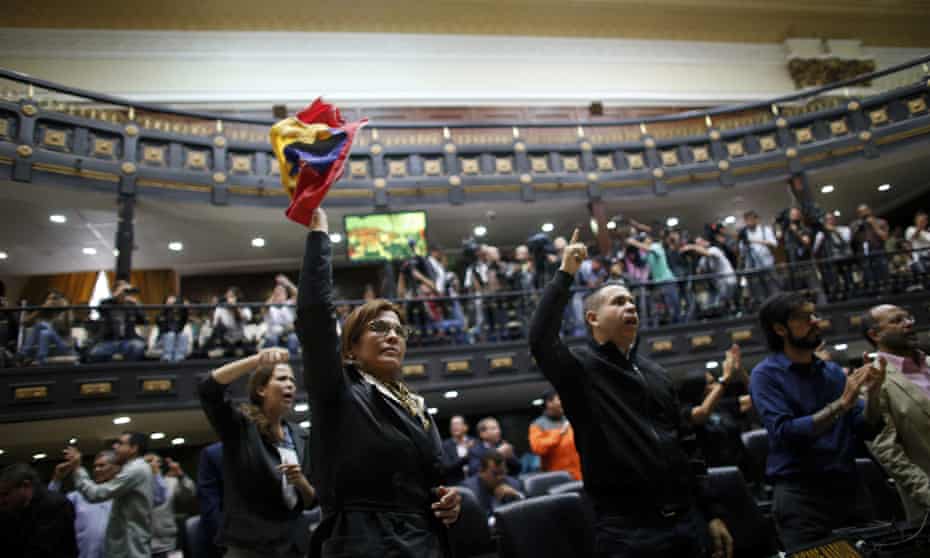 Anti-government lawmakers shout ‘fraud’ during a session of Venezuela’s National Assembly in Caracas Wednesday.