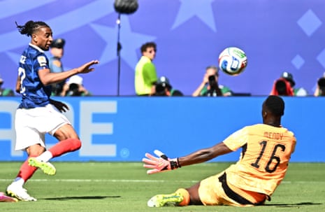 Senegal's keeper Edouard Mendy makes a save from France's Michael Olise.