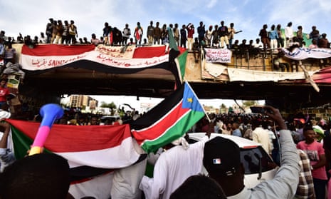 Demonstrators gather near the headquarters of the military in Khartoum