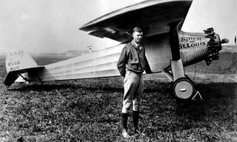Charles Lindbergh, without helmet, poses with his famous plane The Spirit of St Louis in 1927.