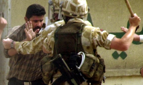 British soldiers detain an Iraqi man in Basra in 2004.