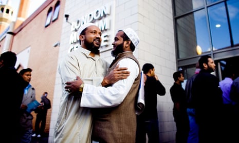 Two Muslim men greet each other outside a mosque in Tower Hamlets.