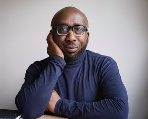 Yinka Bankole today wearing glasses and posing for a photo