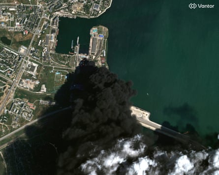 Fuel storage tanks burning in satellite image
