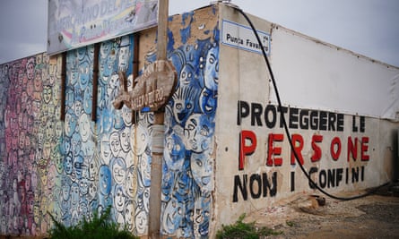 Graffiti that translates as ‘protect people, not borders’ in the port of Lampedusa.