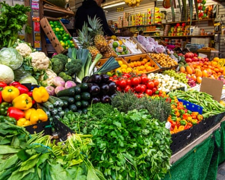 A stall full of fruit and veg.