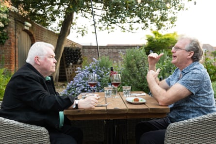 Don and David chatting at an outside restaurant table