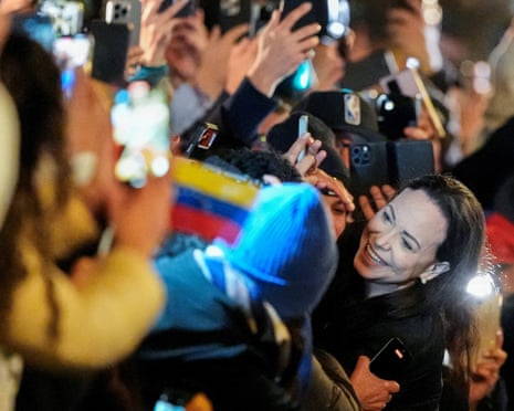 Nobel Peace Prize laureate Maria Corina Machado greets supporters outside the Grand Hotel in Oslo, Norway.
