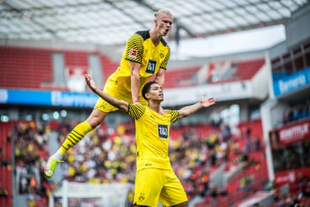Jude Bellingham and Erling Haaland observe a Borussia Dortmund extremity
