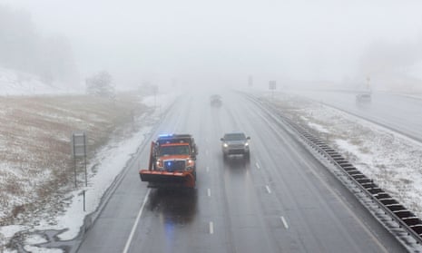 A snowplow patrols in Colorado on Saturday in the initial hours of a winter storm which meteorologists predict could bring several feet of snow to parts of the state.