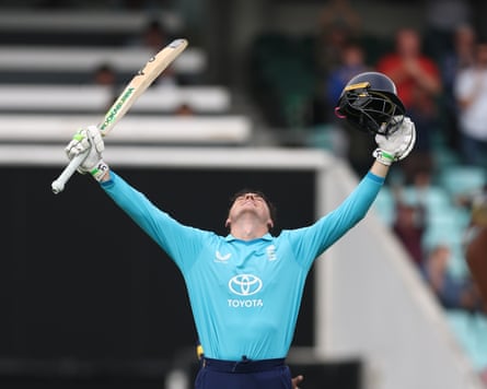 The England batter Tom Banton raises his helmet and bat and looks to the skies after reaching his first international hundred during the third ODI against Sri Lanka at the Oval.