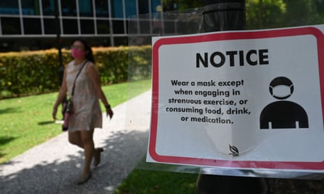 A notice displays advice for people to wear a face mask, to halt the spread of the Covid-19 coronavirus, in Singapore