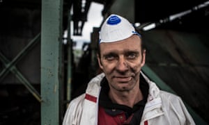The coal-smeared face of a worker.