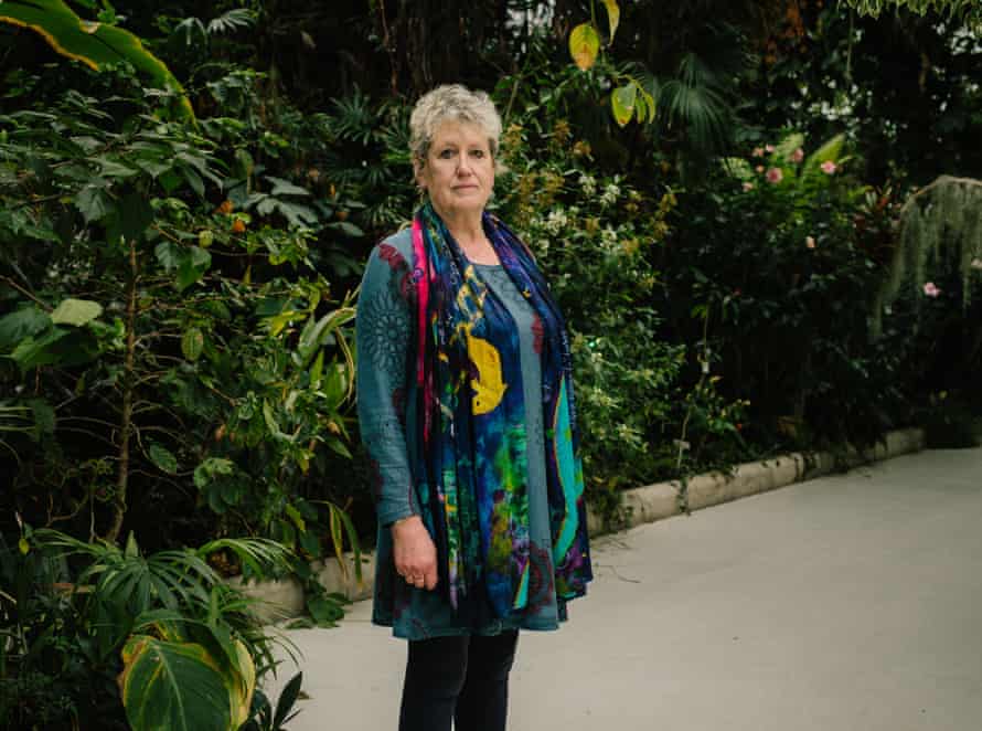 Patricia photographed surrounded by plants in a glasshouse