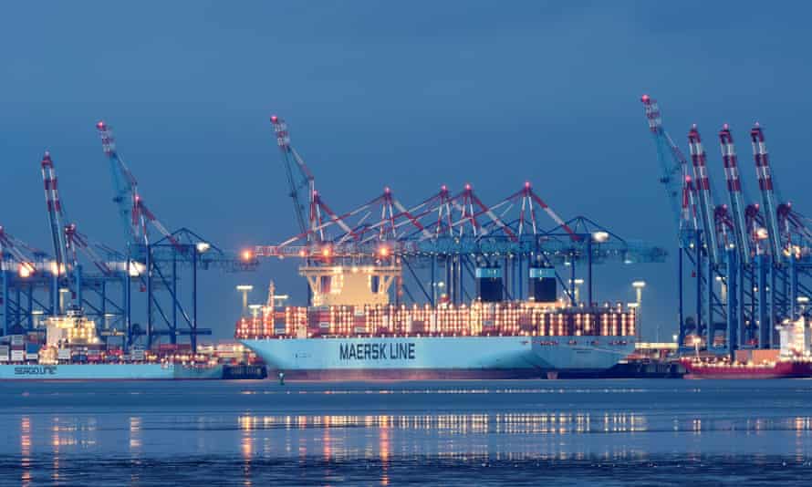 A Maersk container ship is loaded at a harbor terminal in Bremerhaven, Germany.