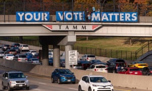 Members of the group Your Vote Matters place signs on an overpass in Saint Louis, Missouri on 6 November 2018.