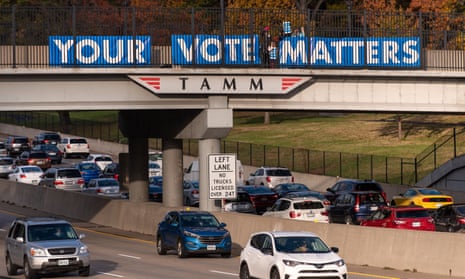 Members of the group Your Vote Matters place signs on an overpass in Saint Louis, Missouri on 6 November 2018. 