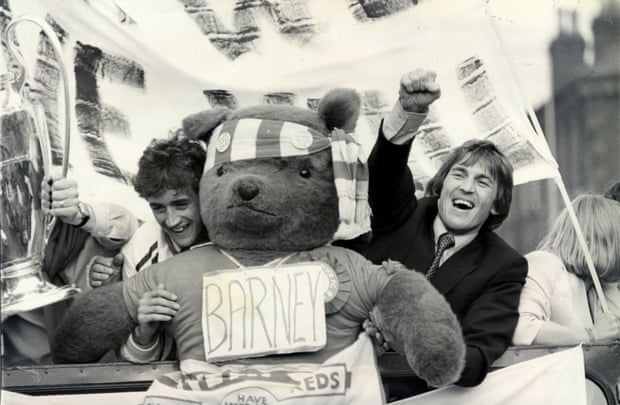 Richard Money and Kenny Dalglish enjoy the open-top bus parade in Liverpool.