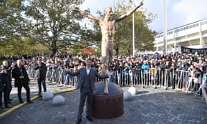 Zlatan Ibrahimovic poses in front of the statue after it was unveiled in October.