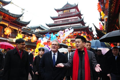 Keir Starmer stood among a group of men during a visit to Yuyuan Gardens in Shanghai, China