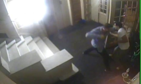 A CCTV image shows the former Wests Tigers prop Matthew Lodge, in the blue shirt, during a violent rampage in the foyer of an apartment building in New York on 16 October 2015.
