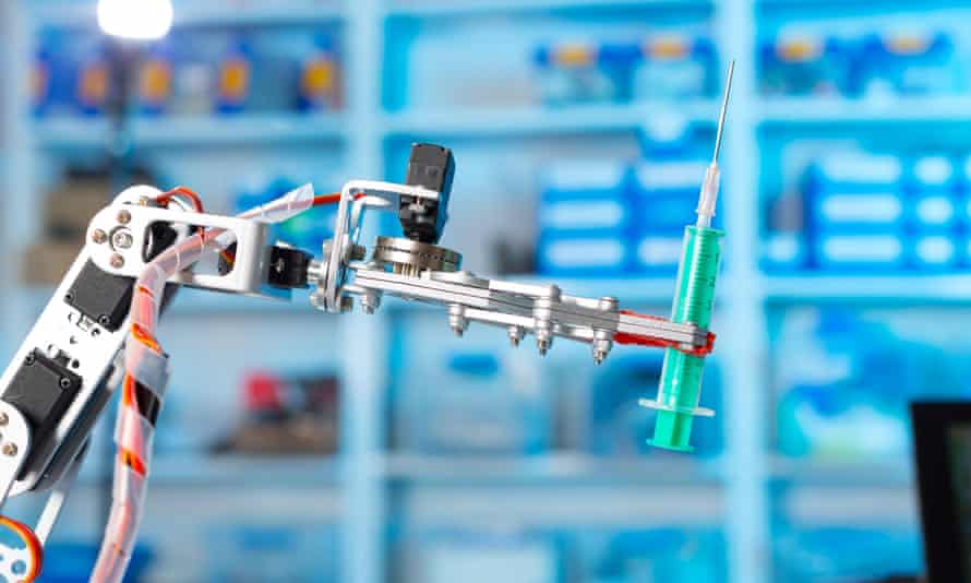 The coming future? A robot holding a medical syringe.