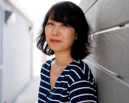 A profile shot of E Tammy Kim