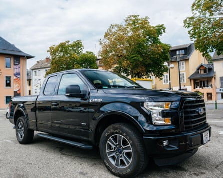 Front view of new F-150 Ford pickup truck in a European square