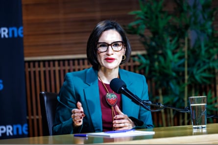 a woman in front of a microphone
