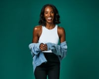 A woman smiles and poses for a portrait