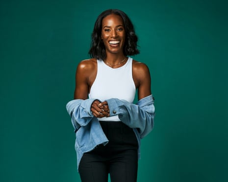 A woman smiles and poses for a portrait