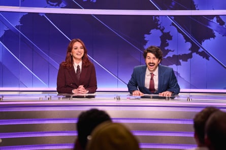 Paddy behind the Weekend Update desk with Ania Magliano.