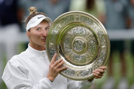 Marketa Vondrousova celebrates with the Venus Rosewater Dish during the prize ceremony after winning the women’s singles final