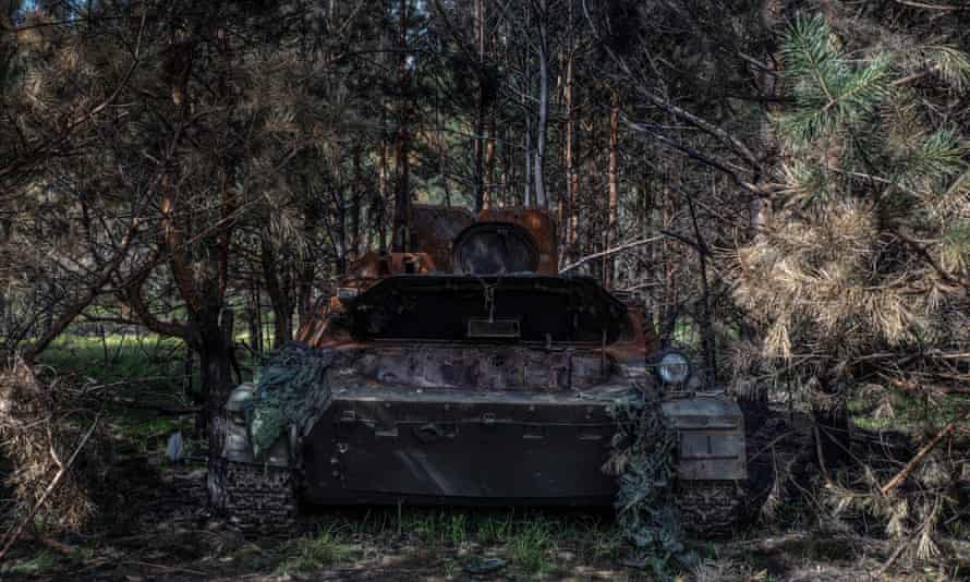 A destroyed Russian armoured personnel carrier found in the forest outside Motyzhyn