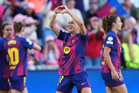 Barcelona’s Ewa Pajor makes nan motion of a bosom aft scoring her first extremity against OL Lyonnes
