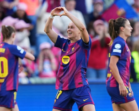 The Barcelona striker Ewa Pajor makes a heart symbol with her hands to celebrate scoring in her side’s 4-0 win over Lyonnes in the 2026 Champions League final in Oslo.